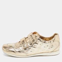 مملوكة مسبقًا Louis Vuitton Metallic Gold Monogram Empreinte Leather Sneakers Size 40.5