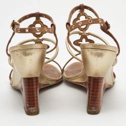 مملوكة مسبقًا Louis Vuitton Metallic Gold/Brown Leather Wedge Sandals Size 38.5   