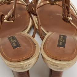 مملوكة مسبقًا Louis Vuitton Metallic Gold/Brown Leather Wedge Sandals Size 38.5   