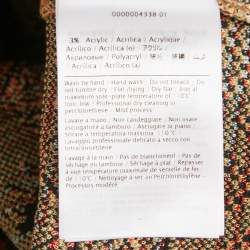 Pre Owned تنورة ميدي إم ميزوني تريكو بنمط زهري بيج/أسود مقاس متوسط