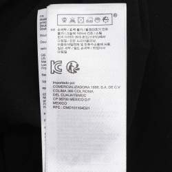 مملوكة مسبقًا فستان ميدي أسود من ماج بدانتيل مع حلقات معدنية وأكمام قصيرة مقاس صغير