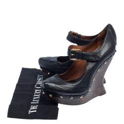Pre Owned McQ By Alexander McQueen Black Leather Studded Wedge Pumps Size 38