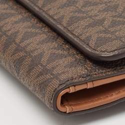 Pre Owned Michael Kors Brown Signature Coated Canvas Large Jet Set Travel Trifold Wallet