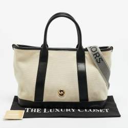 مملوكة مسبقًا حقيبة مايكل كورس لويزا وسط كانفاس أسود/طبيعي وجلد صناعي