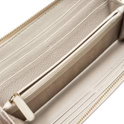 مملوكة مسبقًا محفظة مايكل كورس سحاب ملتف جت ست جلد بيج فاتحة