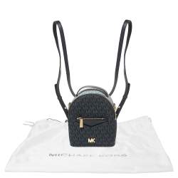 مملوكة مسبقًا حقيبة ظهر مايكل كورس ميني جيسا كانفاس كاروهات مونوغرامي وجلد أزرق