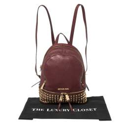 مملوكة مسبقًا Michael Kors Burgundy Leather Small Studded Rhea Backpack