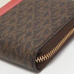 Pre Owned Michael Kors Brown Signature Coated Canvas Zip Around Wristlet Wallet
