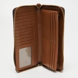 Pre Owned Michael Kors Brown Signature Coated Canvas Zip Around Wristlet Wallet