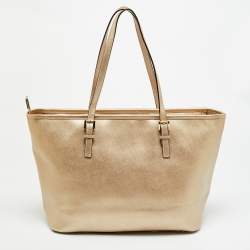 مملوكة مسبقًا حقيبة يد مايكل مايكل كورس جت ست ترافل جلد ذهبي شاحب