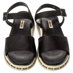 مملوكة مسبقًا صندل ميو ميو نعل سميك سير كاحل كانفاس أسود مقاس 39