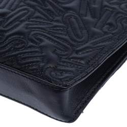Pre Owned Moschino Black Logo Embossed Leather Wristlet Clutch