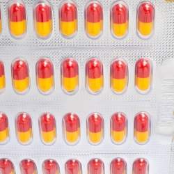 Pre Owned Moschino Silver Leather And PVC Pill Blister Wristlet Clutch