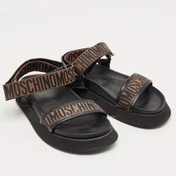 Pre Owned Moschino Brown/Black Canvas Logo Ankle Strap Flat Sandals Size 37