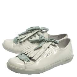 مملوكة مسبقًا Prada Sport Off White Patent Leather Fringe Detail Low Top Sneakers Size 41