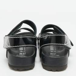 مملوكة مسبقًا صندل برونزا شولر x بيركنستوك جلد أسود مسطح بحزام خلفي مقاس 38