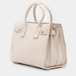 مملوكة مسبقًا حقيبة سان لوران باريس ساك دي جور جلد عجل أبيض صغير برسومات