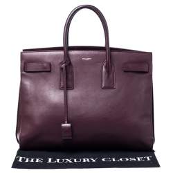 مملوكة مسبقًا حقيبة يد سان لوران ساك دو جور كبيرة جلد عنابية