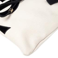 مملوكة مسبقًا حقيبة يد توتس سان لوران كاهالا جلد وكانفاس أسود/كريمي 