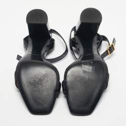 مملوكة مسبقًا صندل سان لوران أوبيوم جلد أسود لامع حزام حول الكاحل مقاس 40.5