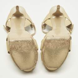 مملوكة مسبقًا صندل سان لوران باريس تريبيوت جلد لامع بيج بنعل سميك مقاس 37.5