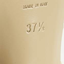 مملوكة مسبقًا صندل سان لوران باريس تريبيوت جلد لامع بيج بنعل سميك مقاس 37.5