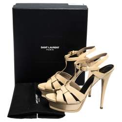 مملوكة مسبقًا صندل سان لوران باريس نعل سميك تريبيوت ج لد بيج لامع مقاس 39