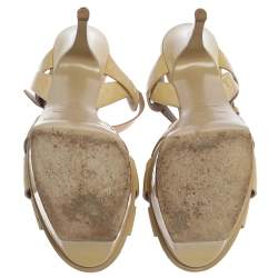 مملوكة مسبقًا صندل سان لوران باريس "تريبوت" جلد لامع بيج مقاس 39