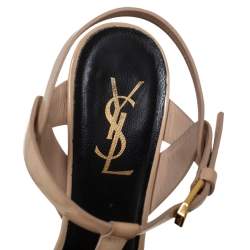 مملوكة مسبقًا صندل سان لوران تريبيوت جلد بيج لامع مقاس 37.5