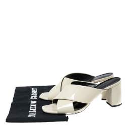 Pre Owned صندل سلايد سان لوران لولو جلد لامع كريمي سيور متعاكسة مقاس 37