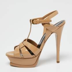 مملوكة مسبقًا صندل سان لوران تريبوت جلد بيج لامع نعل سميك مقاس 36.5