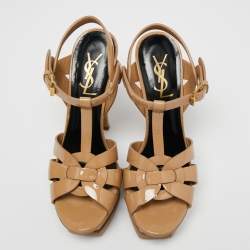 مملوكة مسبقًا صندل سان لوران تريبوت جلد بيج لامع نعل سميك مقاس 36.5