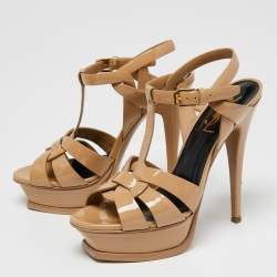 مملوكة مسبقًا صندل سان لوران تريبوت جلد بيج لامع نعل سميك مقاس 36.5