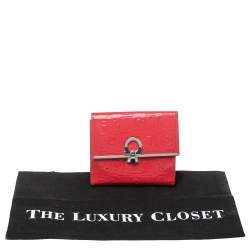 Pre Owned Salvatore Ferragamo Pink Monogram Embossed Patent Leather Gancini Triifold Wallet