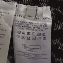 مملوكة مسبقًا بلوزة ستيلا مكارتني صوف منقوش أسود برقبة كاو مقاس صغير جدًا