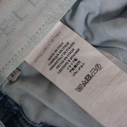 مملوكة مسبقًا بنطلون جينز ستيلا مكارتني دنيم مطبوع نجوم أزرق قصه بويفريند مقاس وسط (ميديوم)