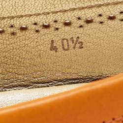 مملوكة مسبقًا Tod's Orange Perforated Leather Bow Slip On Loafers Size 40.5