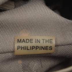 Pre Owned حقيبة ظهر توري برش بشعار رفرف جلد رمادي مزينة بشرابة