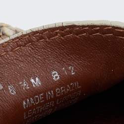 Pre Owned حذاء لوفرز توري برش درايفينغ جلد نقش ثعبان بيج مقاس 38.5