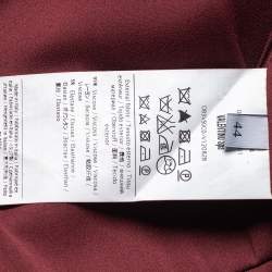 مملوكة مسبقًا فستان ميدي فالنتينو غاذيرد كريب عنابي تفاصيل فيونكة مقاس متوسط - ميديوم 