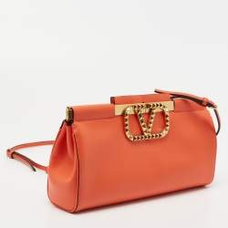 Pre Owned Valentino Orange Leather Rockstud Logo Plaque Clutch