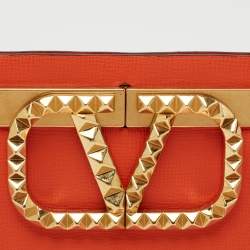 Pre Owned Valentino Orange Leather Rockstud Logo Plaque Clutch