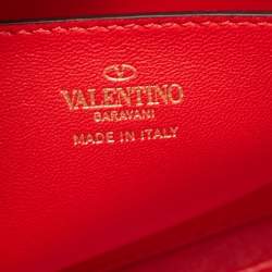 Pre Owned Valentino Orange Leather Rockstud Logo Plaque Clutch