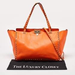Pre Owned Valentino Neon Orange Leather Medium Rockstud Trapeze Tote