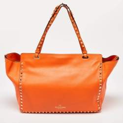 Pre Owned Valentino Neon Orange Leather Medium Rockstud Trapeze Tote