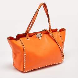 Pre Owned Valentino Neon Orange Leather Medium Rockstud Trapeze Tote