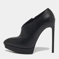 مملوكة مسبقًا بوت للكاحل سان لوران باريس تريبيوت جلد لامع وجلد أسود/ كحلي مقاس 38