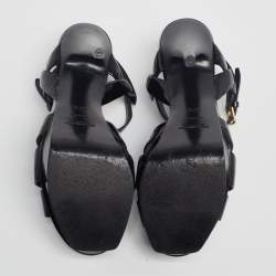 Pre Owned صندل إيف سان لوران تريبوت جلد أسود لامع بحزام للكاحل نعل سميك مقاس 37.5