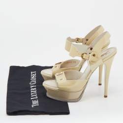 Pre Owned صندل إيف سان لوران جلد كريمي لامع نعل سميك بحزام للكاحل مقاس 38