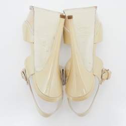 Pre Owned صندل إيف سان لوران جلد كريمي لامع نعل سميك بحزام للكاحل مقاس 38